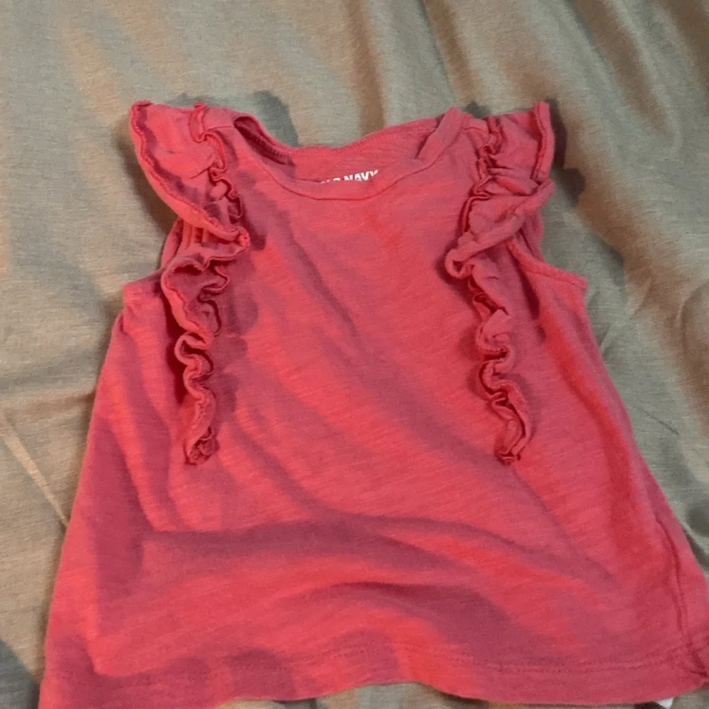 2 sleeveless shirts